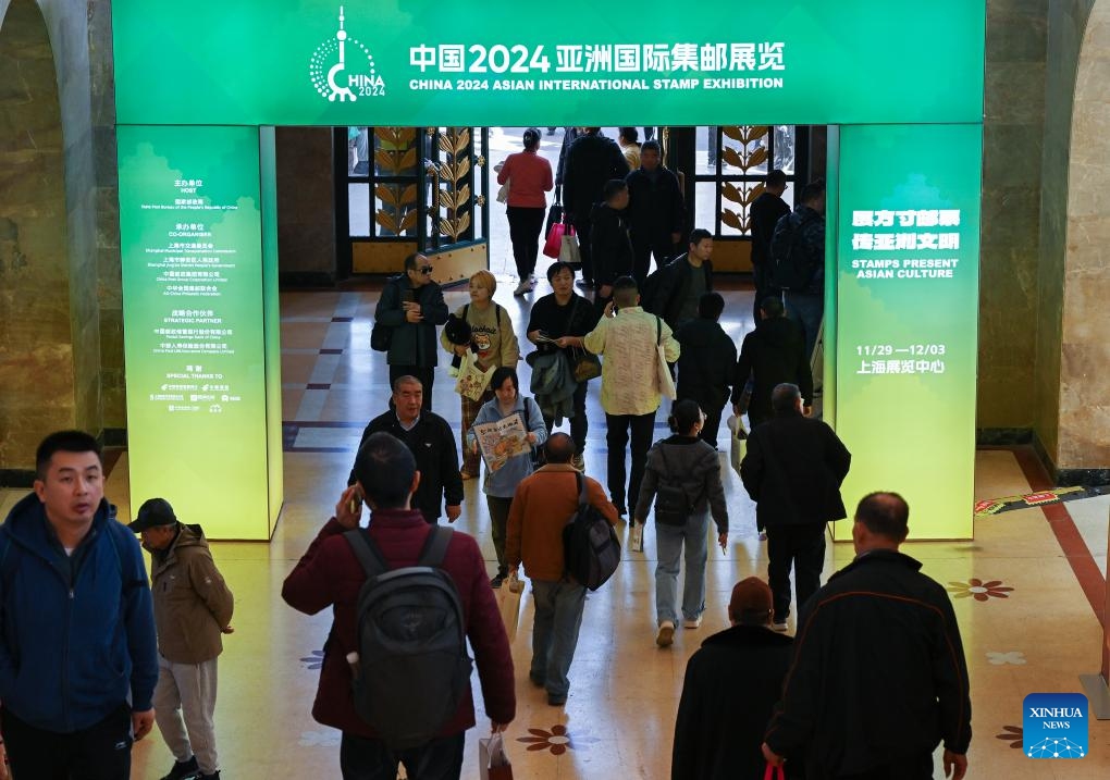 People visit China 2024 Asian International Stamp Exhibition at Shanghai Exhibition Center in east China's Shanghai on Nov. 29, 2024. The exhibition opened on Friday and will last for 5 days. (Xinhua/Li He)