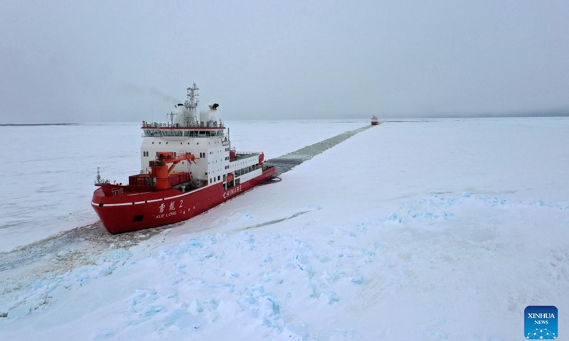 A drone photo taken on Nov. 29, 2024 shows China's research icebreakers Xuelong and Xuelong 2. Currently on China's 41st Antarctic expedition, research icebreakers Xuelong and Xuelong 2, or Snow Dragon and Snow Dragon 2, carried out icebreaking operations surrounding Zhongshan Station, a Chinese research base in Antarctica on Friday. The ships will begin unloading operations after reaching the designated anchoring position. (Photo by Chen Dongbin/Xinhua)