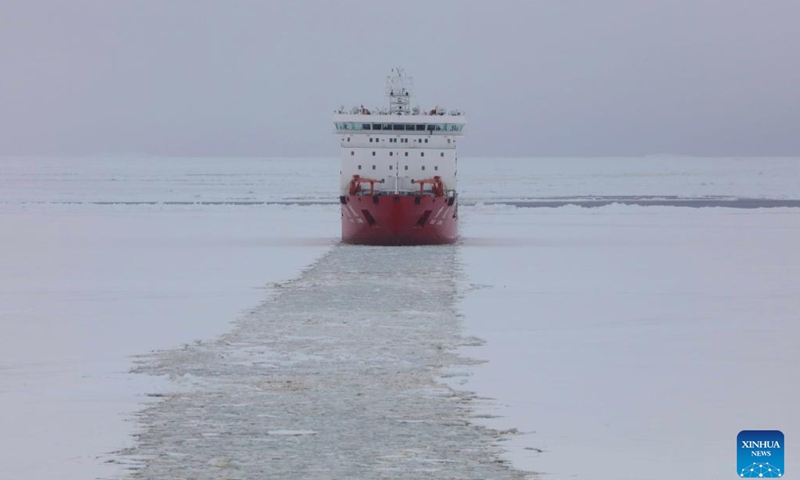 This photo taken on Nov. 29, 2024 shows China's research icebreaker Xuelong sailing at the new broken-through path. Currently on China's 41st Antarctic expedition, research icebreakers Xuelong and Xuelong 2, or Snow Dragon and Snow Dragon 2, carried out icebreaking operations surrounding Zhongshan Station, a Chinese research base in Antarctica on Friday. The ships will begin unloading operations after reaching the designated anchoring position. (Xinhua/Huang Taoming)