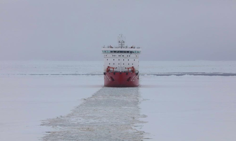 This photo taken on Nov. 29, 2024 shows China's research icebreaker Xuelong sailing at the new broken-through path. Currently on China's 41st Antarctic expedition, research icebreakers Xuelong and Xuelong 2, or Snow Dragon and Snow Dragon 2, carried out icebreaking operations surrounding Zhongshan Station, a Chinese research base in Antarctica on Friday. The ships will begin unloading operations after reaching the designated anchoring position. (Photo: Xinhua)