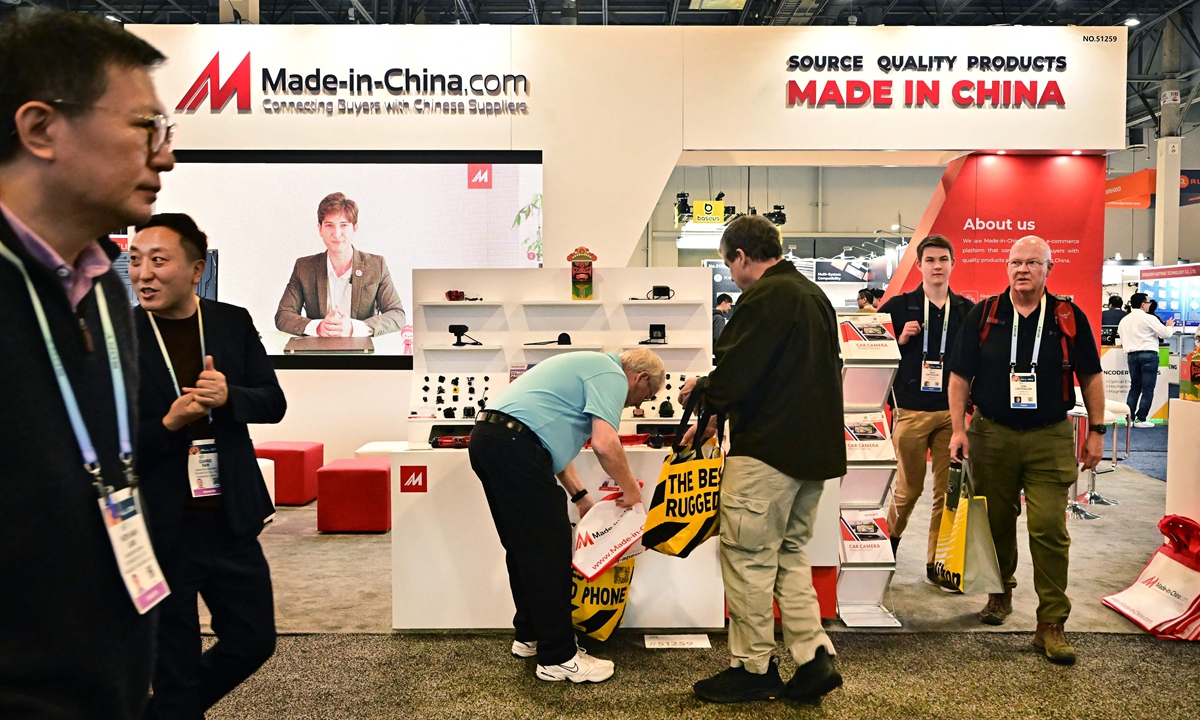 People walk past the Made-In-China.com booth at the Consumer Electronics Show (CES) on January 10, 2024 in Las Vegas, Nevada. Chinese companies are back in full force at CES this year more than doubling the number of exhibitors from last year. (Photo: VCG)