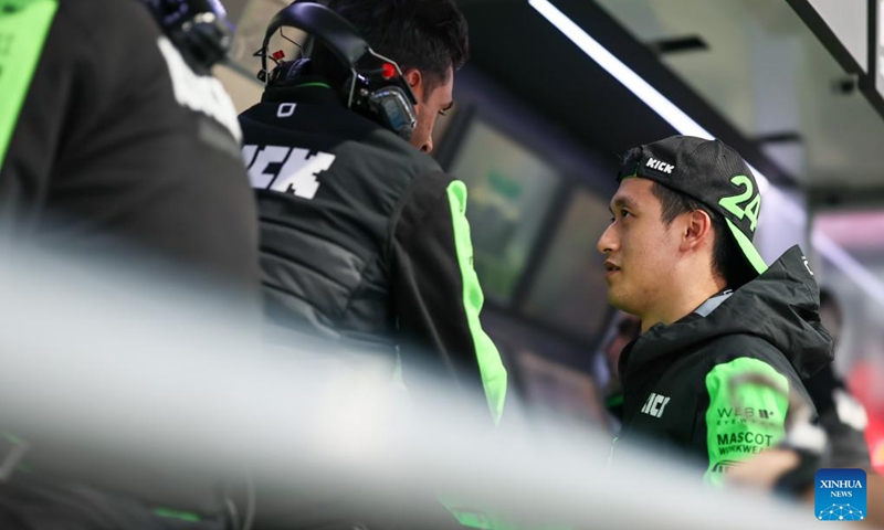 Kick Sauber's Chinese driver Zhou Guanyu (R) is seen prior to the Sprint Race of the Qatar Grand Prix at Lusail International Circuit in Lusail, Qatar, on Nov. 30, 2024. Photo: Xinhua