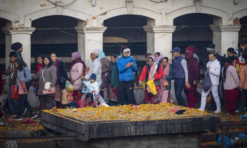 Devotees gather and scatter seven types of grains as a tradition to observe the Bala Chaturdashi festival on the premises of Pashupatinath Temple in Kathmandu, Nepal, Nov. 30, 2024. Photo: Xinhua