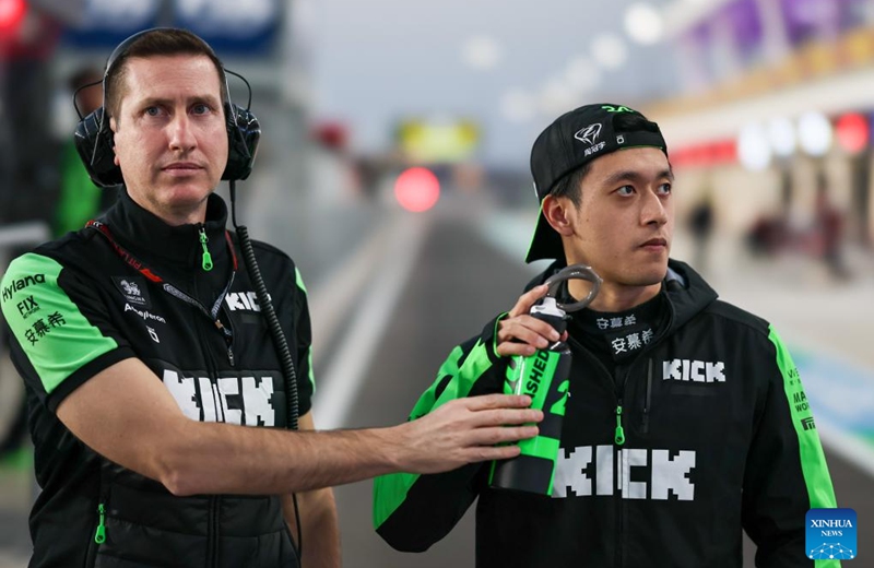 Kick Sauber's Chinese driver Zhou Guanyu (R) is seen prior to the Sprint Race of the Qatar Grand Prix at Lusail International Circuit in Lusail, Qatar, on Nov. 30, 2024. Photo: Xinhua