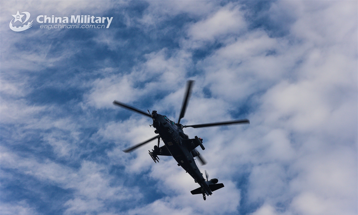 A Z-20 attack helicopter attached to a brigade of the army under the Chinese PLA Southern Theatre Command flies in the sky during a flight training exercise on October 23, 2024. (eng.chinamil.com.cn/Photo by Sun Changyi)