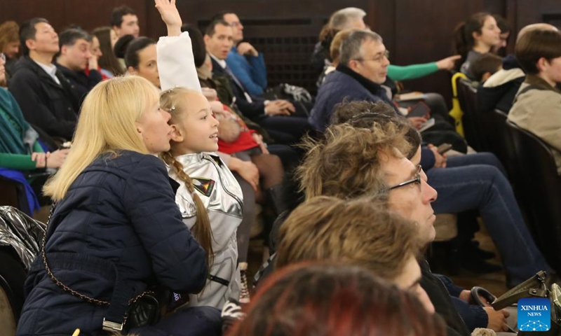 A Bulgarian girl raises her hand to ask questions during the Talking with Taikonauts event in Sofia, Bulgaria, Nov. 30, 2024. Three Chinese astronauts, or taikonauts, connected with Bulgarian youth via video link on Saturday, sharing their experiences in space exploration and answering questions about life aboard the Tiangong space station. Photo: Xinhua