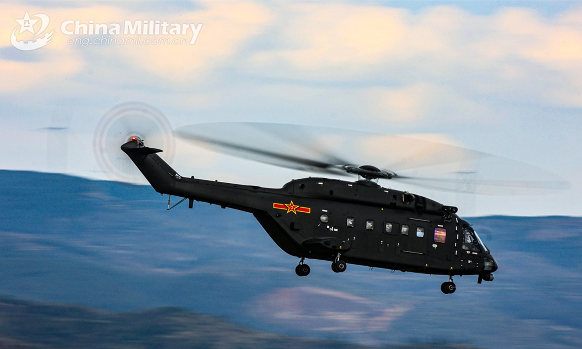 A transport helicopter attached to a brigade of the army under the Chinese PLA Southern Theatre Command flies at a designated altitude during a flight training exercise on October 23, 2024. (eng.chinamil.com.cn/Photo by Sun Changyi)