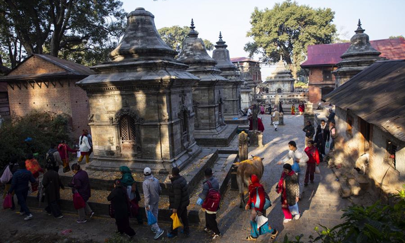 Devotees gather and scatter seven types of grains as a tradition to observe the Bala Chaturdashi festival on the premises of Pashupatinath Temple in Kathmandu, Nepal, Nov. 30, 2024. Photo: Xinhua