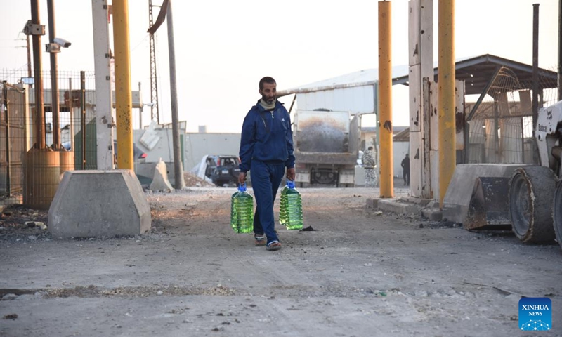 A man walks near the reopened Al-Arida border crossing connecting Lebanon and Syria on Nov. 30, 2024. Israeli warplanes carried out airstrikes targeting 10 official and unofficial border crossings between Syria and Lebanon after midnight Wednesday, Syrian state media and monitoring groups reported. Photo: Xinhua