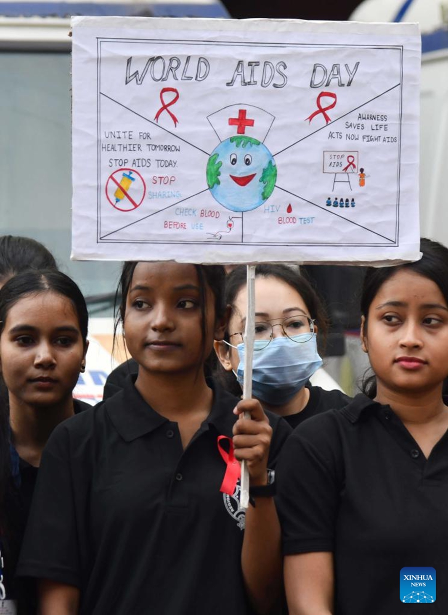 A students holds a placard as she attends an awareness rally on the occasion of World AIDS Day in Guwahati city of India's northeastern state of Assam, Dec. 1, 2024. Photo: Xinhua