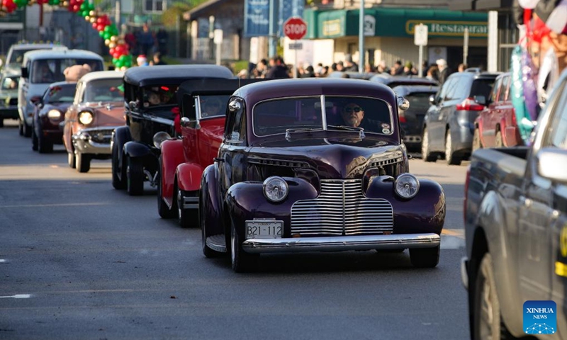 Vintage cars cruise down the street during the annual Christmas Classic Car Cruise event in Richmond, British Columbia, Canada, Dec. 1, 2024. Photo: Xinhua