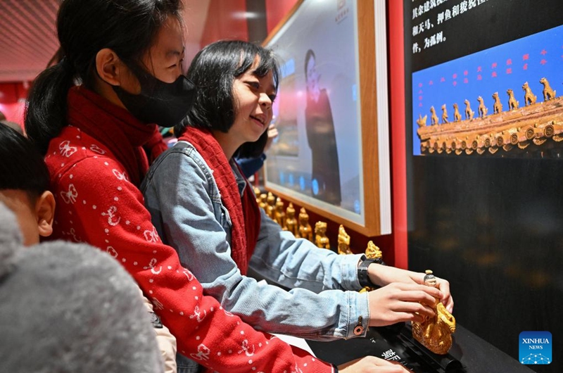 A student from the Beijing School for the Blind touches a model of a Chinese ridge beast at Sensory Experience Gallery of the Palace Museum in Beijing, capital of China, Dec. 1, 2024. Sensory Experience Gallery, co-founded by Palace Museum and China Disabled Persons' Federation, was inaugurated here on Sunday, featuring creative cultural works, cultural experiences, and study tours. It integrates multi-sensory experiences to make culture more accessible for people with disabilities. Photo: Xinhua