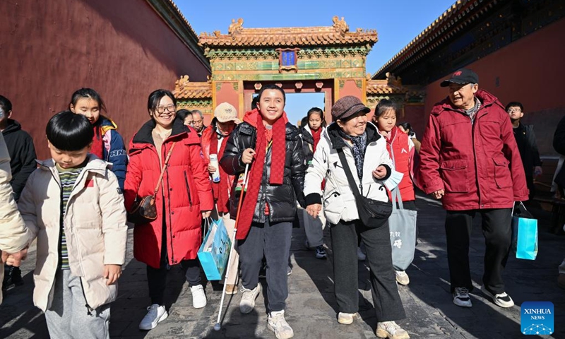 Students from the Beijing School for the Blind, together with their family members and volunteers, visit the Palace Museum in Beijing, capital of China, Dec. 1, 2024. Sensory Experience Gallery, co-founded by Palace Museum and China Disabled Persons' Federation, was inaugurated here on Sunday, featuring creative cultural works, cultural experiences, and study tours. It integrates multi-sensory experiences to make culture more accessible for people with disabilities. Photo: Xinhua