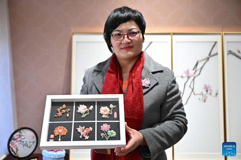 Yu Congxia, an intangible cultural heritage inheritor, shows her knot button works at Sensory Experience Gallery of the Palace Museum in Beijing, capital of China, Dec. 1, 2024. Sensory Experience Gallery, co-founded by Palace Museum and China Disabled Persons' Federation, was inaugurated here on Sunday, featuring creative cultural works, cultural experiences, and study tours. It integrates multi-sensory experiences to make culture more accessible for people with disabilities. Photo: Xinhua