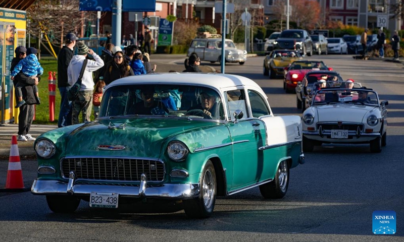 Vintage cars cruise down the street during the annual Christmas Classic Car Cruise event in Richmond, British Columbia, Canada, Dec. 1, 2024. Photo: Xinhua