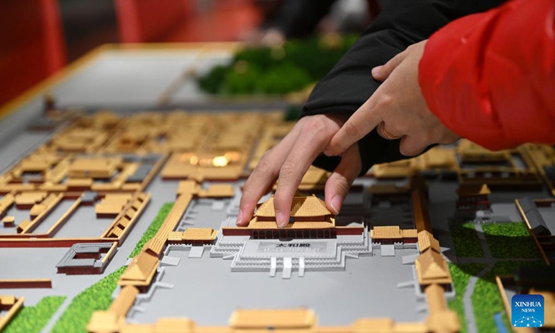 A student from the Beijing School for the Blind touches a sand table model of the Palace Museum at Sensory Experience Gallery of the Palace Museum in Beijing, capital of China, Dec. 1, 2024. Sensory Experience Gallery, co-founded by Palace Museum and China Disabled Persons' Federation, was inaugurated here on Sunday, featuring creative cultural works, cultural experiences, and study tours. It integrates multi-sensory experiences to make culture more accessible for people with disabilities. Photo: Xinhua