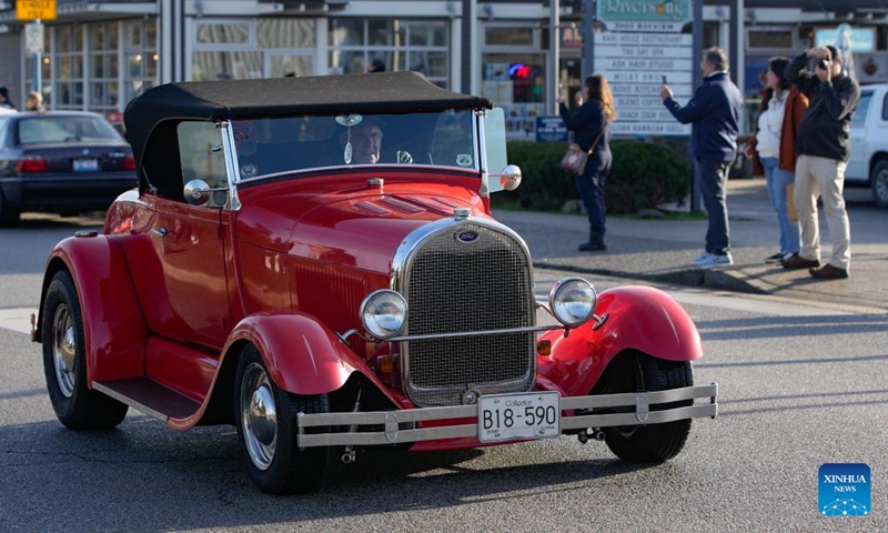 A vintage car cruises down the street during the annual Christmas Classic Car Cruise event in Richmond, British Columbia, Canada, Dec. 1, 2024. Photo: Xinhua