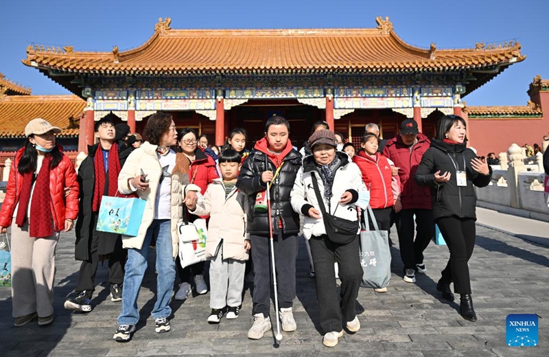 Students from the Beijing School for the Blind, together with their family members and volunteers, visit the Palace Museum in Beijing, capital of China, Dec. 1, 2024. Sensory Experience Gallery, co-founded by Palace Museum and China Disabled Persons' Federation, was inaugurated here on Sunday, featuring creative cultural works, cultural experiences, and study tours. It integrates multi-sensory experiences to make culture more accessible for people with disabilities. Photo: Xinhua