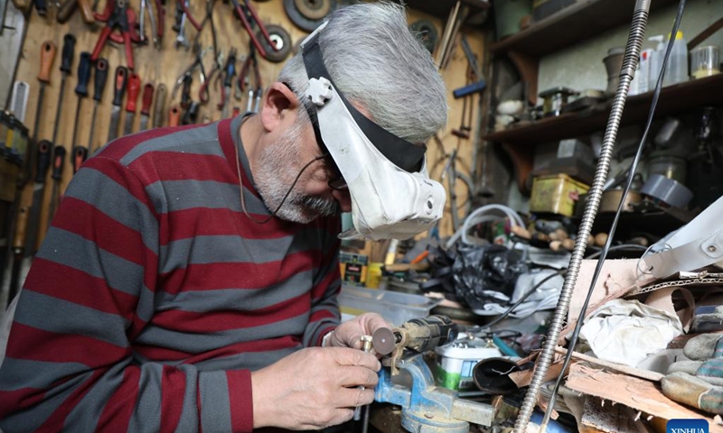 A senior works at a store in Ankara, Türkiye, on Dec. 2, 2024. Türkiye's high cost of living is pushing an increasing number of seniors back into the workforce to make ends meet, according to a leading pensioners' association. (Photo: Xinhua)