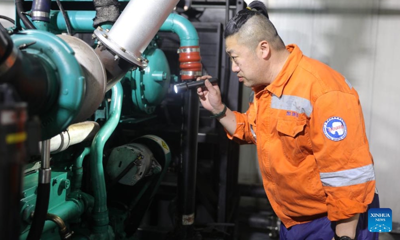 Zhang Dong, head of the power generation team, checks the condition of a generator at China's Zhongshan Station in Antarctica, Dec. 1, 2024. (Photo: Xinhua)