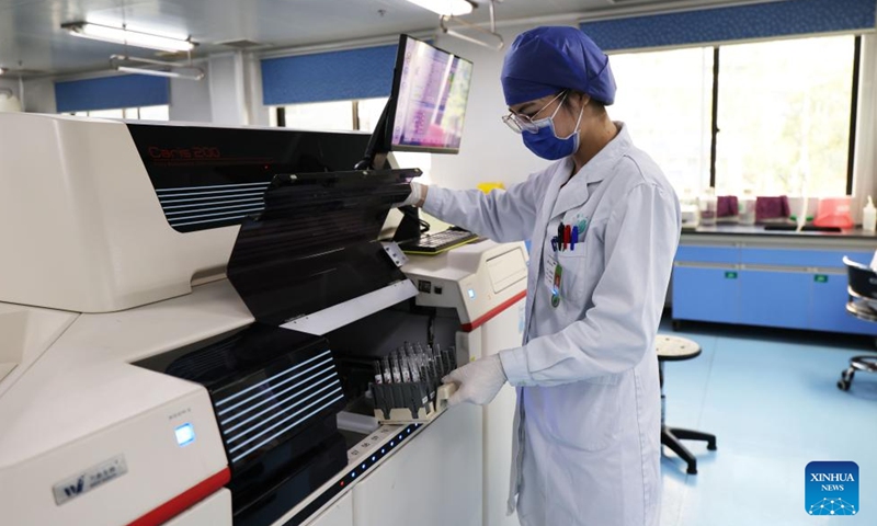 A doctor tests samples for HIV/AIDS infection at the Fourth People's Hospital of Nanning, in Nanning, south China's Guangxi Zhuang Autonomous Region, Nov. 21, 2024. (Photo: Xinhua)