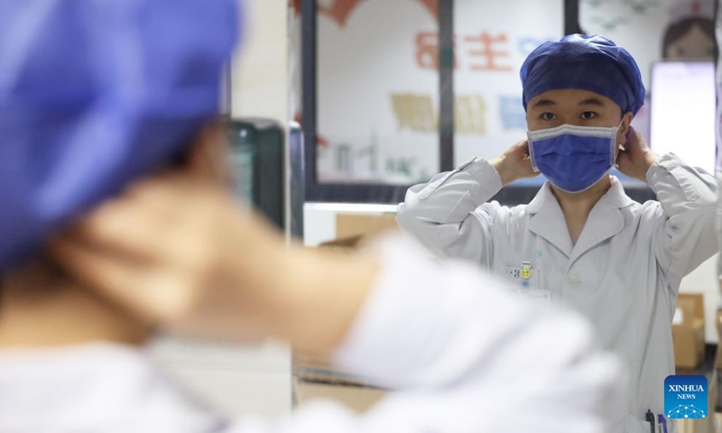 Zhao Rui prepares for the ward rounds at the Department of Infectious Diseases at the Fourth People's Hospital of Nanning, in Nanning, south China's Guangxi Zhuang Autonomous Region, Nov. 24, 2024. (Photo: Xinhua)