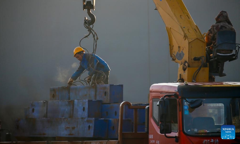 Workers work at the construction site of an expressway overpass in Qujing City, southwest China's Yunnan Province, Dec. 1, 2024. Multiple transportation infrastructure projects are currently under construction in Yunnan, which are expected to greatly improve the transportation system in the province. (Photo: Xinhua)