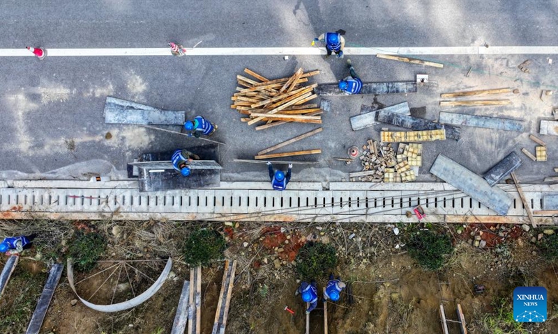 An aerial drone photo shows workers working at the construction site of an expressway in Yiliang County of Kunming, southwest China's Yunnan Province, Dec. 2, 2024. Multiple transportation infrastructure projects are currently under construction in Yunnan, which are expected to greatly improve the transportation system in the province. (Photo: Xinhua)