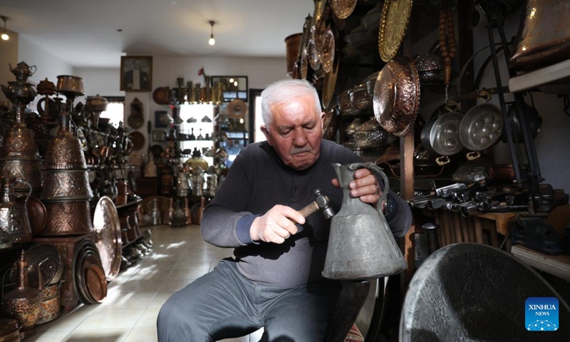 A senior works at a store in Ankara, Türkiye, on Dec. 2, 2024. Türkiye's high cost of living is pushing an increasing number of seniors back into the workforce to make ends meet, according to a leading pensioners' association. (Photo: Xinhua)