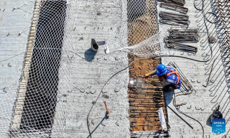 An aerial drone photo shows a worker working at the construction site of an expressway in Yiliang County of Kunming, southwest China's Yunnan Province, Dec. 2, 2024. Multiple transportation infrastructure projects are currently under construction in Yunnan, which are expected to greatly improve the transportation system in the province. (Photo: Xinhua)