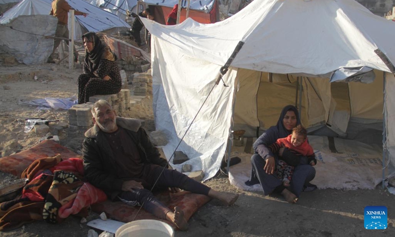 Displaced Palestinians are seen at a temporary shelter in Gaza City, on Dec. 1, 2024. (Photo: Xinhua)