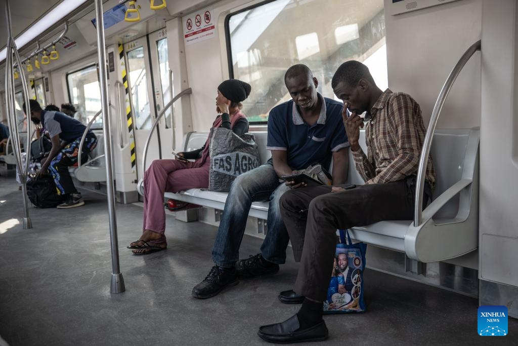 Passengers are pictured inside a train of the Lagos Rail Mass Transit (LRMT) Blue Line in Lagos, Nigeria, on Dec. 1, 2024. Started in July 2010 and accomplished in December 2022, the first phase of the LRMT Blue Line corridor project contracted by China Civil Engineering Construction Corporation (CCECC) is the first electrified railroad and cross-sea light rail project in West Africa. Spaning 13 km and covering five stations, this line kicked off its commercial operation in September 2023, and has been reckoned a symbolic project of the Belt and Road Initiative. (Photo: Xinhua)