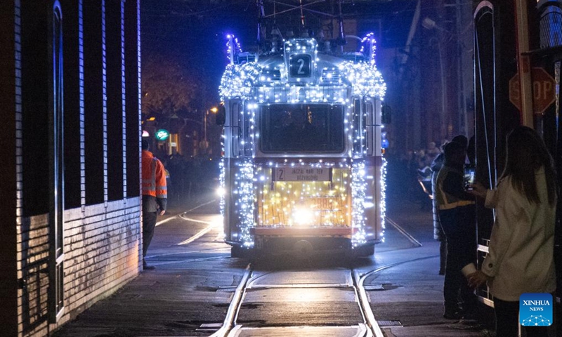 A Christmas light-decorated tram is seen at the depot before it starts operation in Budapest, Hungary on Dec. 2, 2024. (Photo: Xinhua)