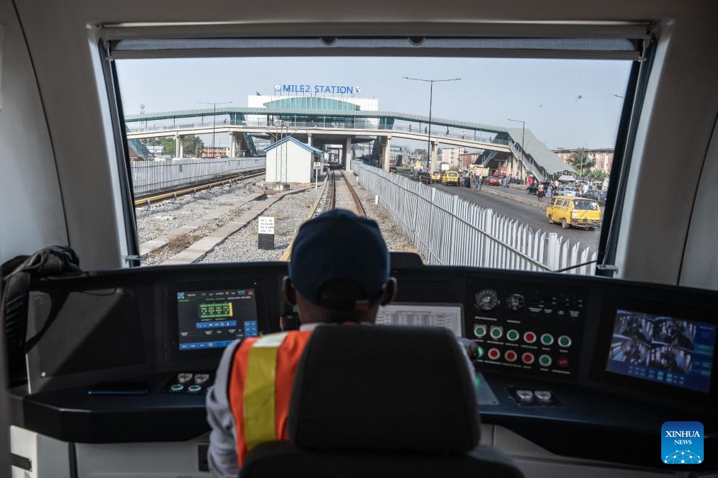 A driver operates a train of the Lagos Rail Mass Transit (LRMT) Blue Line in Lagos, Nigeria, on Dec. 1, 2024. Started in July 2010 and accomplished in December 2022, the first phase of the LRMT Blue Line corridor project contracted by China Civil Engineering Construction Corporation (CCECC) is the first electrified railroad and cross-sea light rail project in West Africa. Spaning 13 km and covering five stations, this line kicked off its commercial operation in September 2023, and has been reckoned a symbolic project of the Belt and Road Initiative. (Photo: Xinhua)