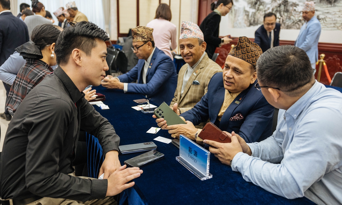 Chinese and Nepalese business representatives gather to discuss new opportunities for practical economic and trade cooperation at the Nepal-China Business Summit, in Beijing on December 4, 2024, with Prime Minister of Nepal KP Sharma Oli in attendance to address the summit. Photo: Li Hao/GT