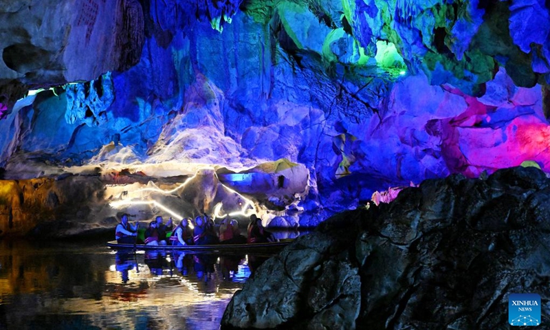 People visit a cave at the Qixingyan scenic spot of the Xinghu Scenic Area in Zhaoqing, south China's Guangdong Province, Dec. 2, 2024. Xinghu is a national 5A-level scenic area, noted for its natural scenery, rich cliff inscriptions since the Tang Dynasty (618-907), and a variety of rare plants and animals. Photo: Xinhua