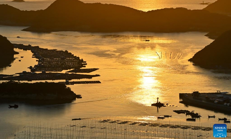 This photo shows the sunrise scenery in Sansha Town of Xiapu County, southeast China's Fujian Province, Nov. 29, 2024. Xiapu County is blessed with sinuate seashore along with numerous tidal flats, islands and reefs. Through coordinated strategies for both ecological conservation and economic development, the county has transformed itself into a stunning hub of thriving tourism industry. Photo: Xinhua