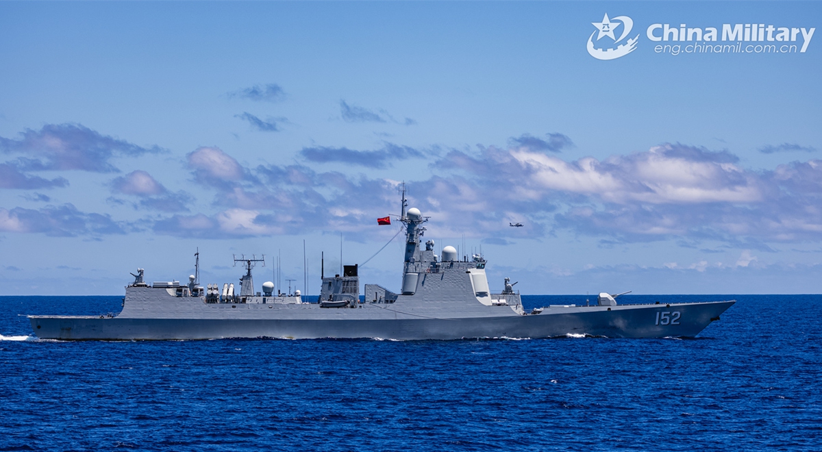 Type 052C guided-missile destroyer Jinan (Hull 152) attached to a naval fleet of the Chinese People's Liberation Army (PLA) coordinates with a helicopter during a replenishment-at-sea training exercise on November 8, 2024.  (eng.chinamil.com.cn/Photo by Wan Haichao)