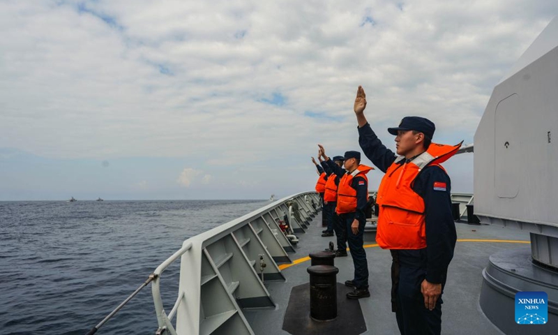 Chinese sailors wave good-bye to their Vietnamese counterparts during a two-day joint patrol with Vietnamese navy in the Beibu Gulf, Dec. 4, 2024. Two fleets from the Chinese and Vietnamese navies on Wednesday concluded a two-day joint patrol in the Beibu Gulf. Photo: Xinhua