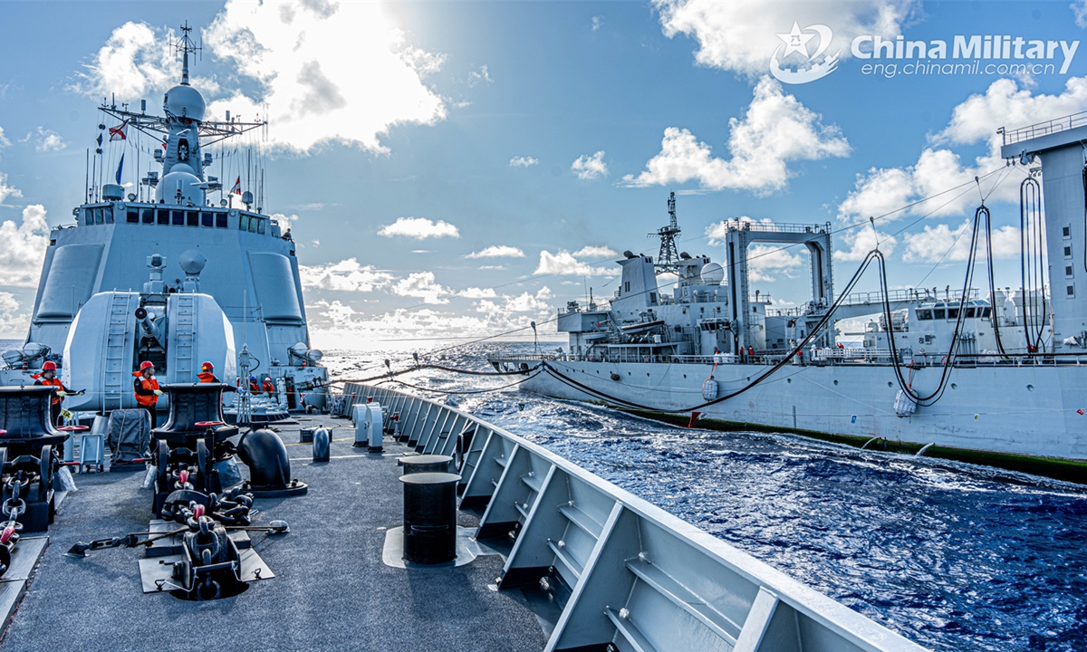 A destroyer and a comprehensive supply ship attached to a naval fleet of the Chinese People's Liberation Army (PLA) conduct the alongside replenishment operation during a replenishment-at-sea training exercise on November 8, 2024.  (eng.chinamil.com.cn/Photo by Wan Haichao)