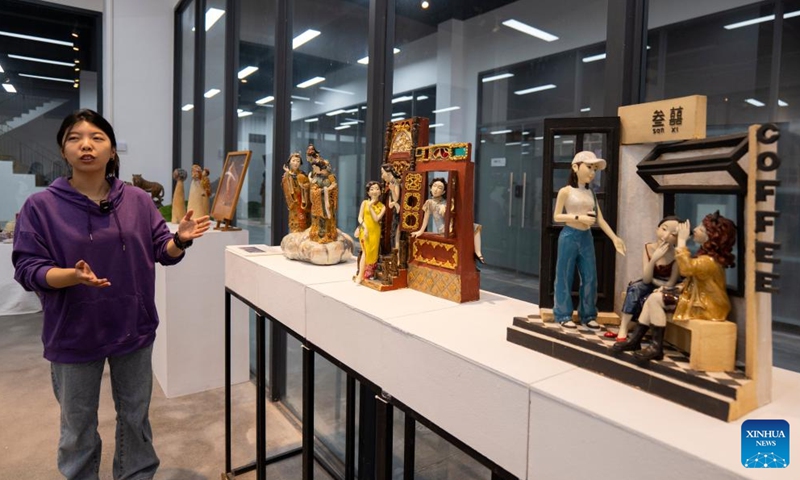 Craft artist Huang Wei introduces pottery pieces with creative elements at an art studio of Meitaowan in Foshan, south China's Guangdong Province, Dec. 3, 2024. Meitaowan, literally translated as bay of beautiful ceramics, has been known for its development in ceramic arts. The municipal government established this area by transforming old factory buildings into cultural facilities and creative spaces. It is now home to studios of numerous ceramic art masters and fashion brands that aim to drive urban renewal and industrial transformation. Photo: Xinhua