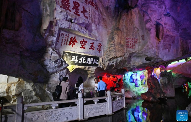 People view cliff inscriptions at the Qixingyan scenic spot of the Xinghu Scenic Area in Zhaoqing, south China's Guangdong Province, Dec. 2, 2024. Xinghu is a national 5A-level scenic area, noted for its natural scenery, rich cliff inscriptions since the Tang Dynasty (618-907), and a variety of rare plants and animals. Photo: Xinhua