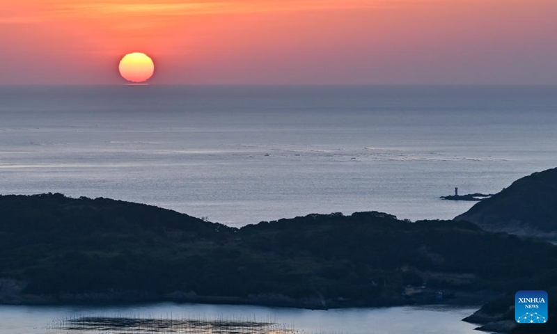 This photo shows the sunrise scenery in Sansha Town of Xiapu County, southeast China's Fujian Province, Nov. 29, 2024. Xiapu County is blessed with sinuate seashore along with numerous tidal flats, islands and reefs. Through coordinated strategies for both ecological conservation and economic development, the county has transformed itself into a stunning hub of thriving tourism industry. Photo: Xinhua