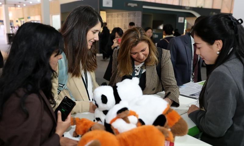 People visit the China Pavilion during the 16th Conference of the Parties (COP16) to the United Nations Convention to Combat Desertification (UNCCD) in Riyadh, Saudi Arabia, on Dec. 2, 2024. Covering more than 600 square meters, the China Pavilion is the second-largest national pavilion at the event. Its exhibition, themed Cross-Century Green Great Wall, China's Restoration in Action, showcases the nation's battle against desertification, particularly through the Three-North Shelter Forest Program, a major national initiative aimed at reversing land desertification. Photo: Xinhua