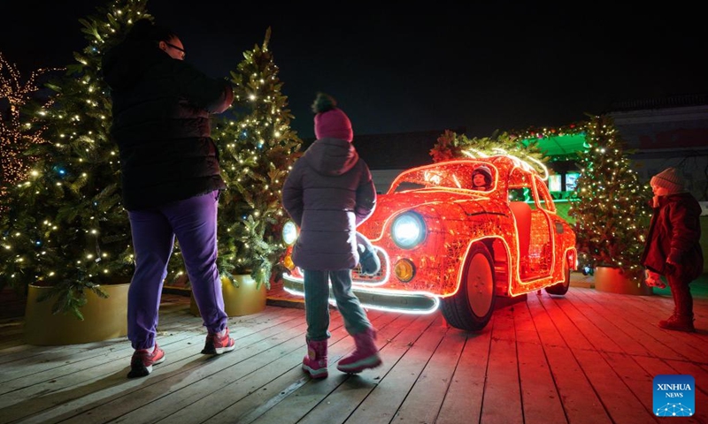 People look at a light decoration in Warsaw, Poland, on Dec. 5, 2024. Photo: Xinhua