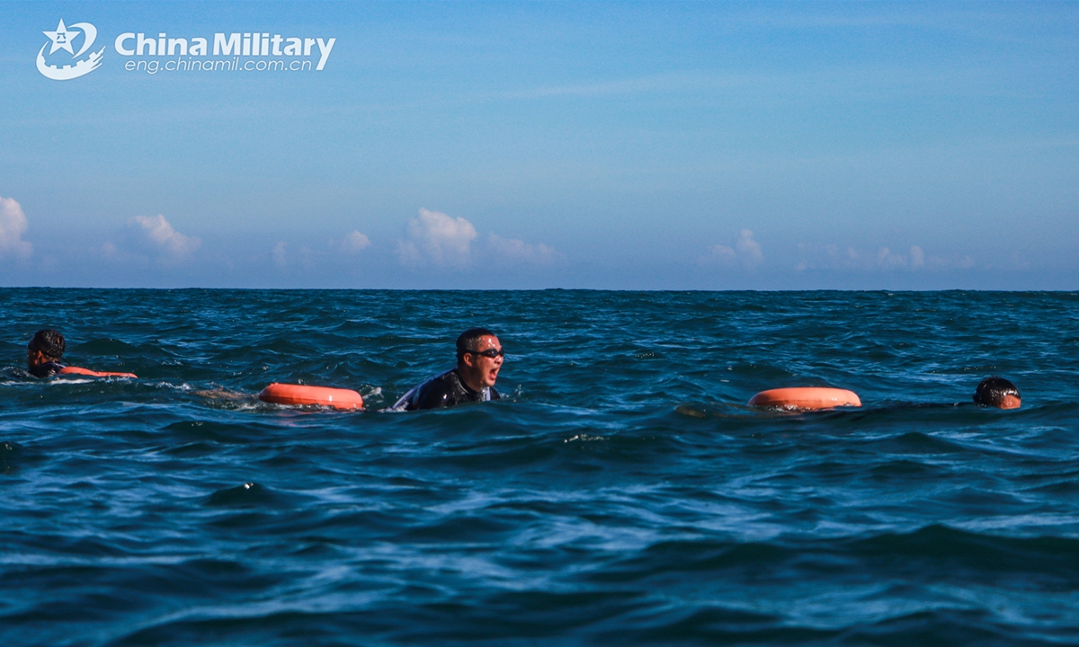 Soldiers assigned to the Chinese PLA Army practice swimming skills during a waterborne infiltration training exercise on November 6, 2024. (eng.chinamil.com.cn/Photo by Pu Songling)