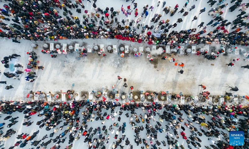 An aerial drone photo shows a view of an ice collecting festival in Harbin, northeast China's Heilongjiang Province, Dec. 7, 2024. Marking the beginning of Harbin's ice collecting season, the fifth ice collecting festival kicked off here by the Songhua River on Saturday, attracting lots of people with ice collecting ceremony and performances. Photo: Xinhua