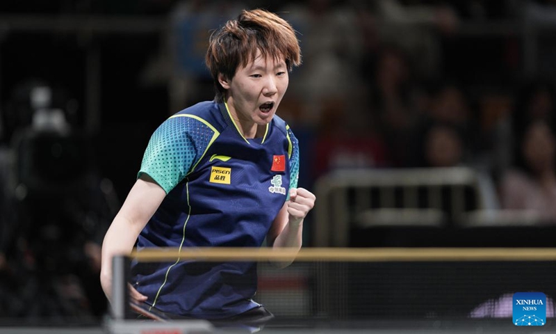 Wang Manyu of China celebrates in the game against Adina Diaconu of Romania during the semifinal match between China and Romania at the ITTF Mixed Team World Cup 2024 in Chengdu, southwest China's Sichuan Province, Dec. 8, 2024.  Photo: Xinhua