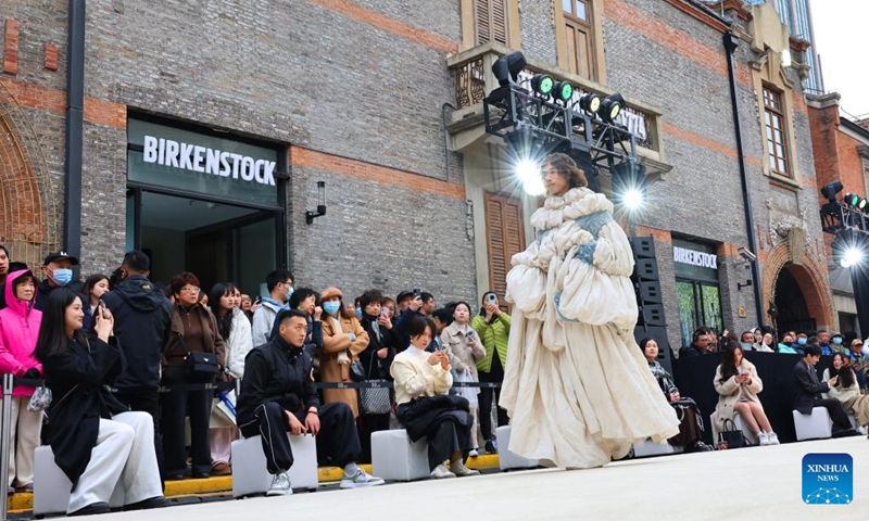 A model presents a creation during a fashion show held at Zhangyuan, or Zhang's Garden, in east China's Shanghai, Dec. 7, 2024. With the century-old Shikumen complex as the background and the Maoming North Road as the runway, a fashion show was held here on Saturday, bringing together the creations of many outstanding young designers in China. Photo: Xinhua