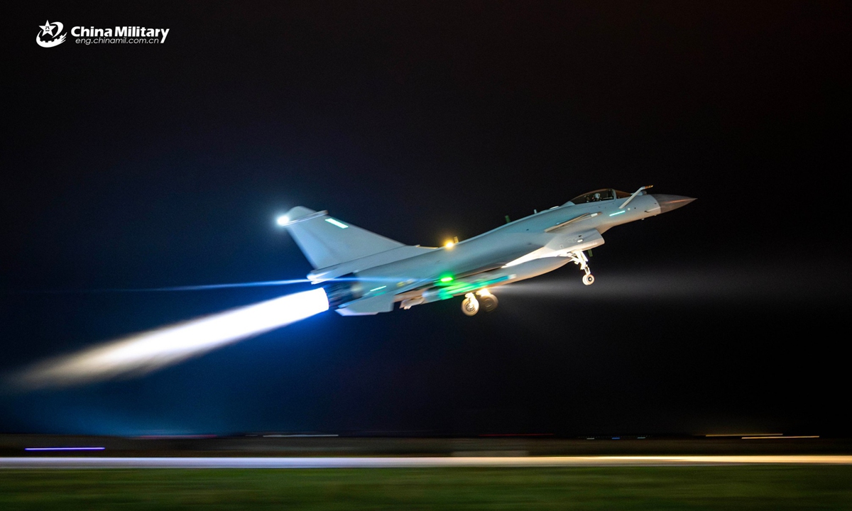 A J-10 fighter jet attached to an aviation brigade with the air force under Chinese PLA Southern Theater Command takes off for a nighttime flight training exercise. The exercise started at midnight and lasted until dawn. (eng.chinamil.com.cn/Photo by Wang Guoyun)